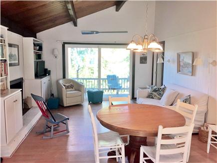 Wellfleet Cape Cod vacation rental - Open concept living/dining area with slider to deck.