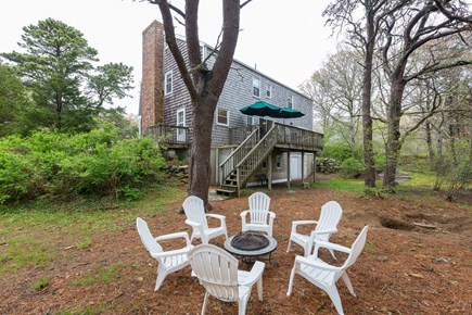 Eastham Cape Cod vacation rental - Fire pit for evening gatherings, outdoor shower behind the stairs