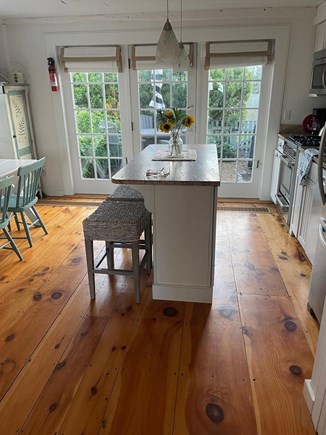 New Seabury, Mashpee Cape Cod vacation rental - Kitchen looking out towards back patio.