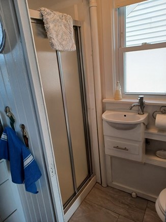 North Truro Cape Cod vacation rental - Classic cottage bathroom, shower stall and adorable sink.