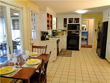 Falmouth, 10min walk to town    mile1  t Cape Cod vacation rental - Tiled kitchen with dining area, facing water