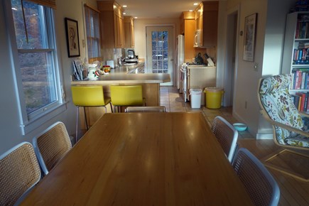 Truro, Corn Hill, Castle Road Area Cape Cod vacation rental - Dining table, which can seat 8, with kitchen in the background.