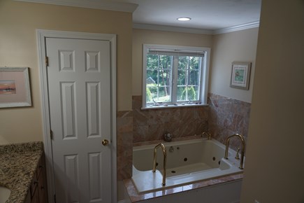 East Dennis Cape Cod vacation rental - Master bathroom, jacuzzi tub, his and showers, private toilet