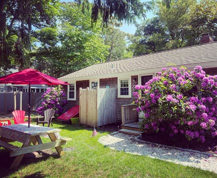 Brewster Cape Cod vacation rental - Pretty side yard, clothesline, fenced on 3 sides for privacy