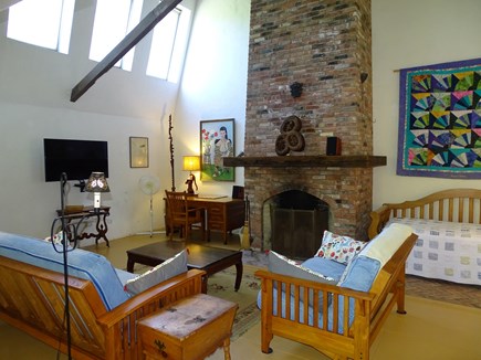 Provincetown Cape Cod vacation rental - Vaulted living room with impressive fireplace