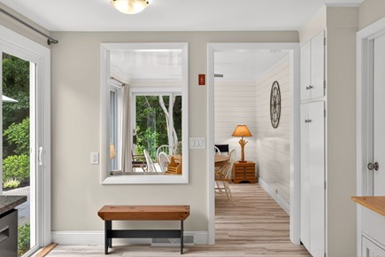 Brewster Cape Cod vacation rental - Kitchen to sunroom, sliders to terrace at left