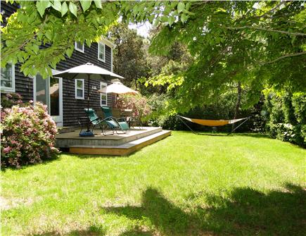 Chatham Cape Cod vacation rental - Outdoor dining on deck overlooking yard - with sun and shade