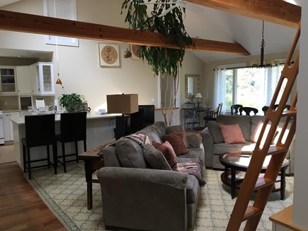 Chatham Cape Cod vacation rental - Living Room, open kitchen rear left with counter and barstools