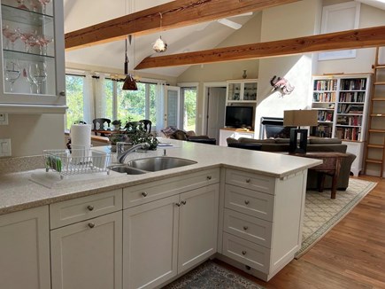 Chatham Cape Cod vacation rental - Pristine Kitchen, natural sunlight over fireplace & book shelves