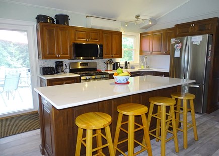 North Eastham Cape Cod vacation rental - Kitchen with all appliance, wine fridge, slider to back deck 