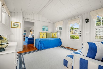 East Dennis/Sesuit Harbor Cape Cod vacation rental - Sitting Porch with Couch, Daybed, Closet and chest of drawers