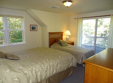 Harwich Cape Cod vacation rental - Upstairs bedroom with queen and twin, slider to upper deck