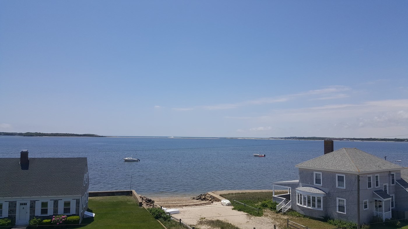 Large deck off the bedrooms. Walk across the street to the beach!