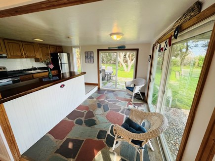 Yarmouth on Lewis Bay Cape Cod vacation rental - Kitchen overlooking grill, patio & Forever Wild Land.