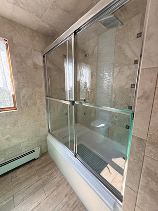 Eastham Cape Cod vacation rental - Main house upstairs bathroom with glass-enclosed shower.