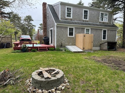 South Chatham Cape Cod vacation rental - Backyard with Fire Pit and Outdoor Shower