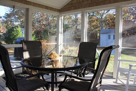 Forest Beach, South Chatham Cape Cod vacation rental - Screen porch accesses dining room, deck & backyard, day & night