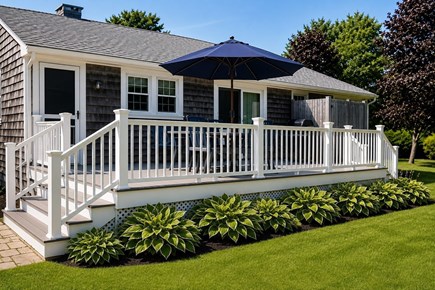 Dennisport Cape Cod vacation rental - The oversized deck is perfect for morning coffee or BBQ dinners.