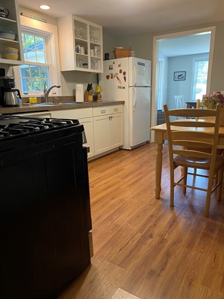 South  Yarmouth, Bass River Cape Cod vacation rental - Spacious kitchen with dining table, microwave and dishwasher.