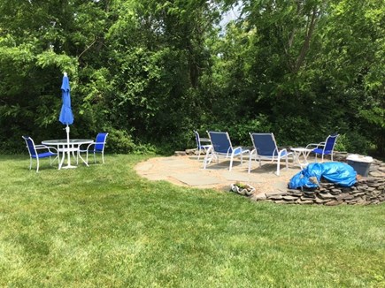 Dennis Bayside Cape Cod vacation rental - Patio area with firepit and spacious yard