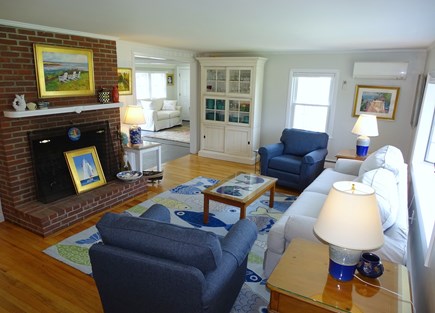 West Harwich Cape Cod vacation rental - Bright living room with bay window and fireplace