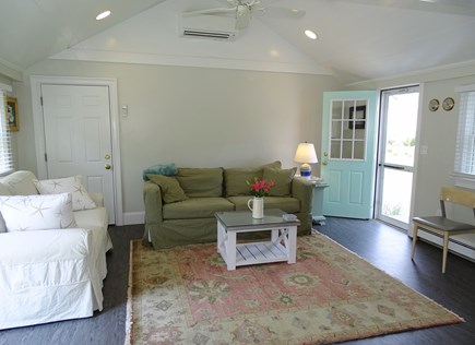 West Harwich Cape Cod vacation rental - Vaulted den with TV and door to back patio