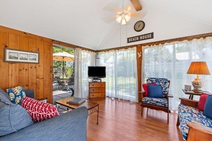 Dennis Port Cape Cod vacation rental - Sunroom with views of backyard & loads of light