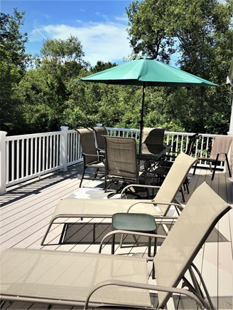  South Harwich Cape Cod vacation rental - Large, Azek deck with table, umbrella and lounge chairs.