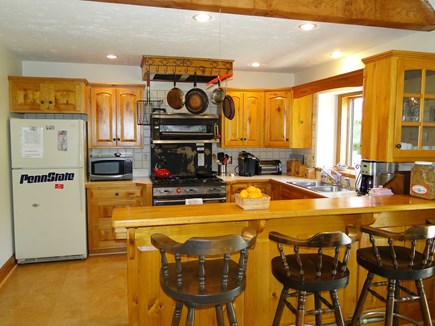 Harwich Cape Cod vacation rental - Kitchen area with breakfast bar, adjacent to dining room