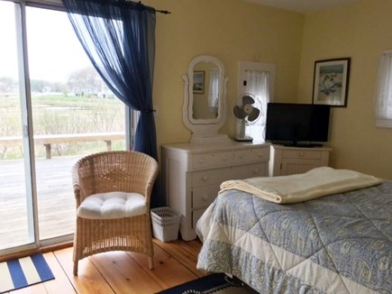 Dennisport Cape Cod vacation rental - Master bedroom w/queen bed, sliders to the deck & water views