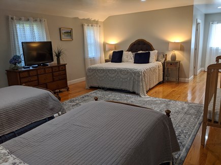 Brewster Cape Cod vacation rental - Primary bedroom 400 sq ft w/King bed, 2 twins & crib fam flexible