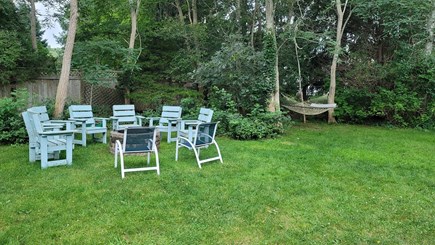 Brewster Cape Cod vacation rental - Large backyard with wood grill and hammock perfect for relaxing.