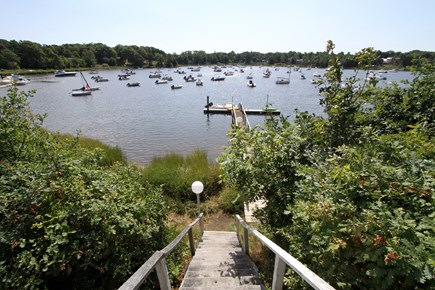 East Orleans Cape Cod vacation rental - Lawn view of  Meeting House Pond and dock.5 Kayaks with rental.