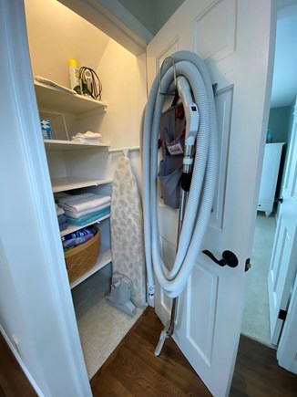 North Chatham, Beach, Harbor Cape Cod vacation rental - Linen Closet and Built-in Vacume hose storage, basic supplies.