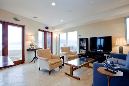 Wellfleet Cape Cod vacation rental - Living room with expansive views, deck and entertainment center