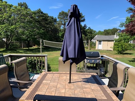Eastham Cape Cod vacation rental - Sunny back yard with volleyball and corn hole tables