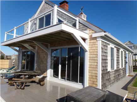West Yarmouth Cape Cod vacation rental - Ocean facing bank of sliders in living room, MBR, upstairs loft