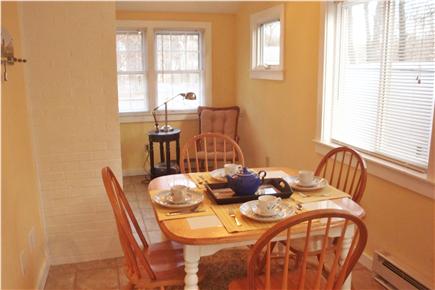 South Dennis Cape Cod vacation rental - Dining area with sliders to back deck & yard