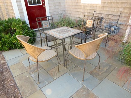 Brewster Cape Cod vacation rental - Small patio and gardens on east side of the house.