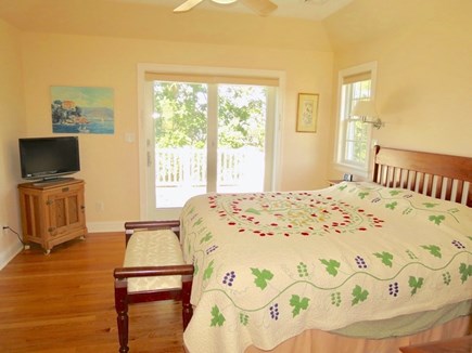 Brewster Cape Cod vacation rental - Master bedroom, with king bed and flat screen TV.  Sliders walk out to second level deck.