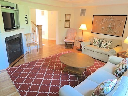 Brewster Cape Cod vacation rental - Main level living room.  Note large flat screen TV over fireplace