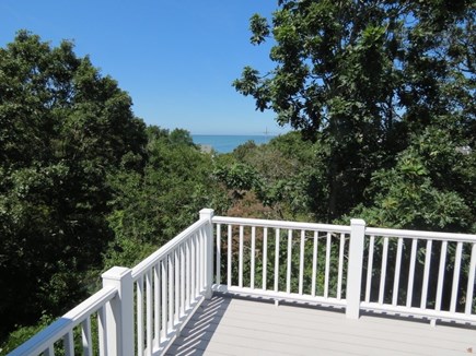 Brewster Cape Cod vacation rental - Peek at the bay from second level deck off master bedroom.
