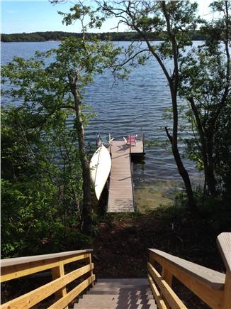 Brewster Cape Cod vacation rental - Stairs down to private dock with canoe