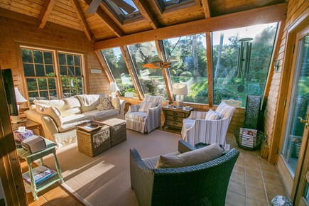 Brewster Cape Cod vacation rental - Sunroom with TV open to kitchen.