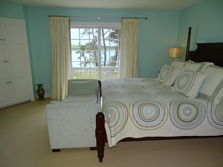 Brewster Cape Cod vacation rental - Master bedroom with king size bed. View of the pond. Has TV.