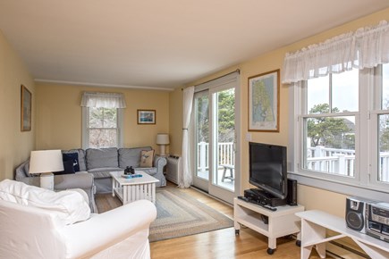 South Wellfleet Cape Cod vacation rental - Living room with access to the deck
