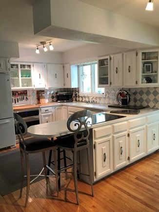 barnstable Cape Cod vacation rental - Sunny “easy to work in” kitchen overlooking beautiful backyard