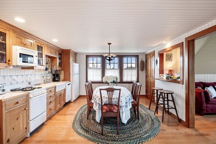 Orleans Cape Cod vacation rental - Open floor concept with kitchen and dining leading to living room or primary bedroom.