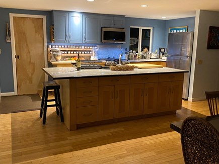 North Eastham Cape Cod vacation rental - Fully stocked kitchen opens to dining, living and screen porch.