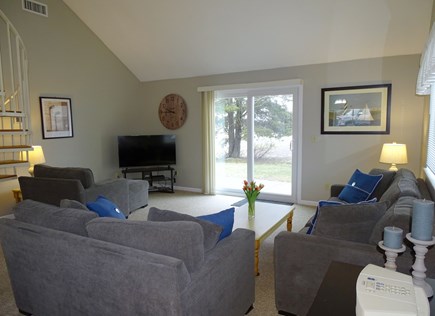 Ocean Edge, Brewster Cape Cod vacation rental - Living room with TV, slider to patio